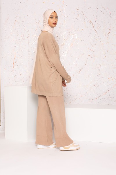Beige knit jumper and flare pants set with visible seam