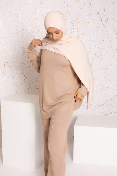 Beige knit jumper and flare pants set with visible seam
