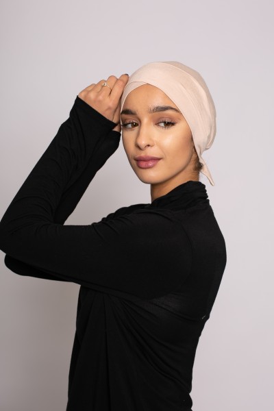 Nude crossover tie cap