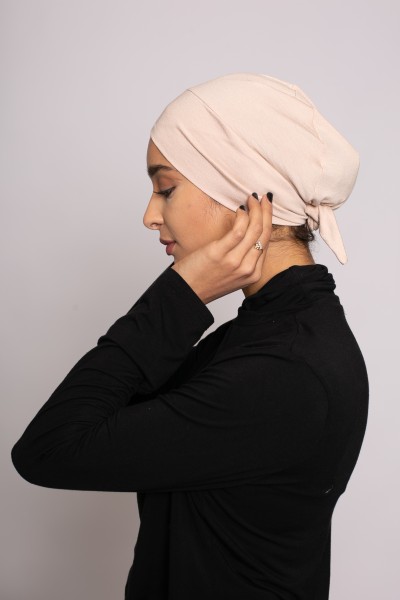 Nude crossover tie cap