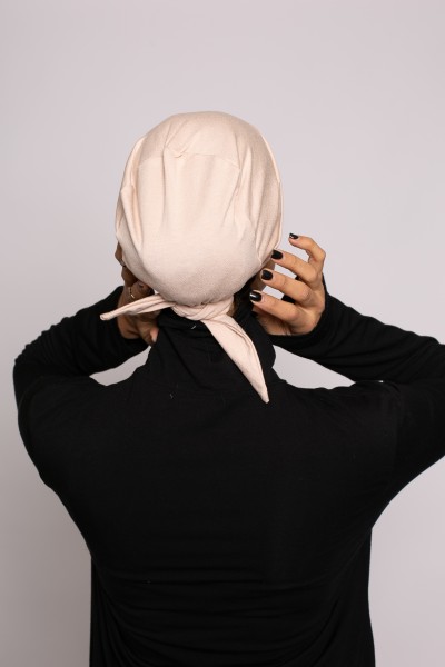 Nude crossover tie cap