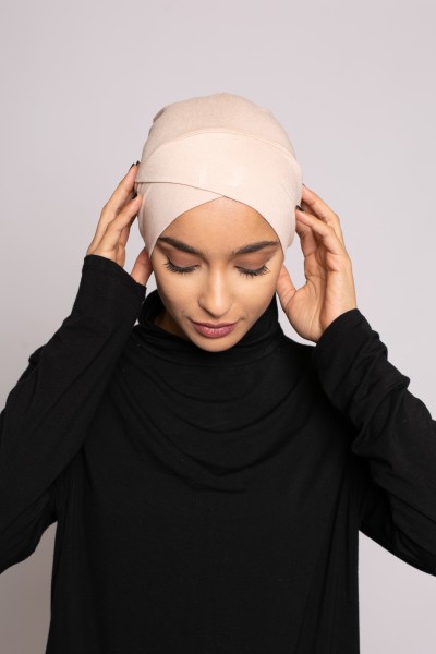 Nude crossover tie cap