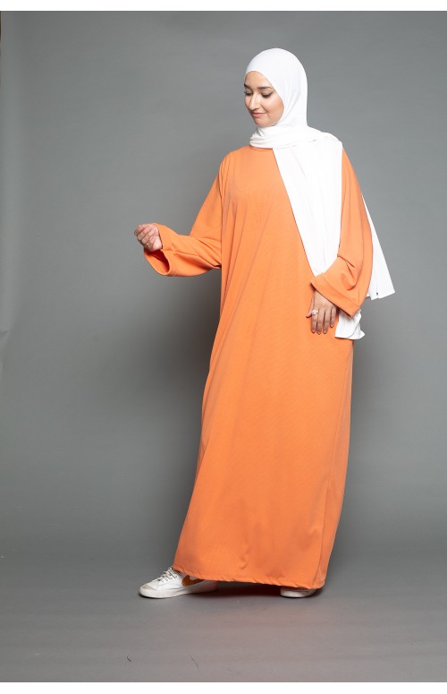 abaya oversize orange pour jeune femme musulmane